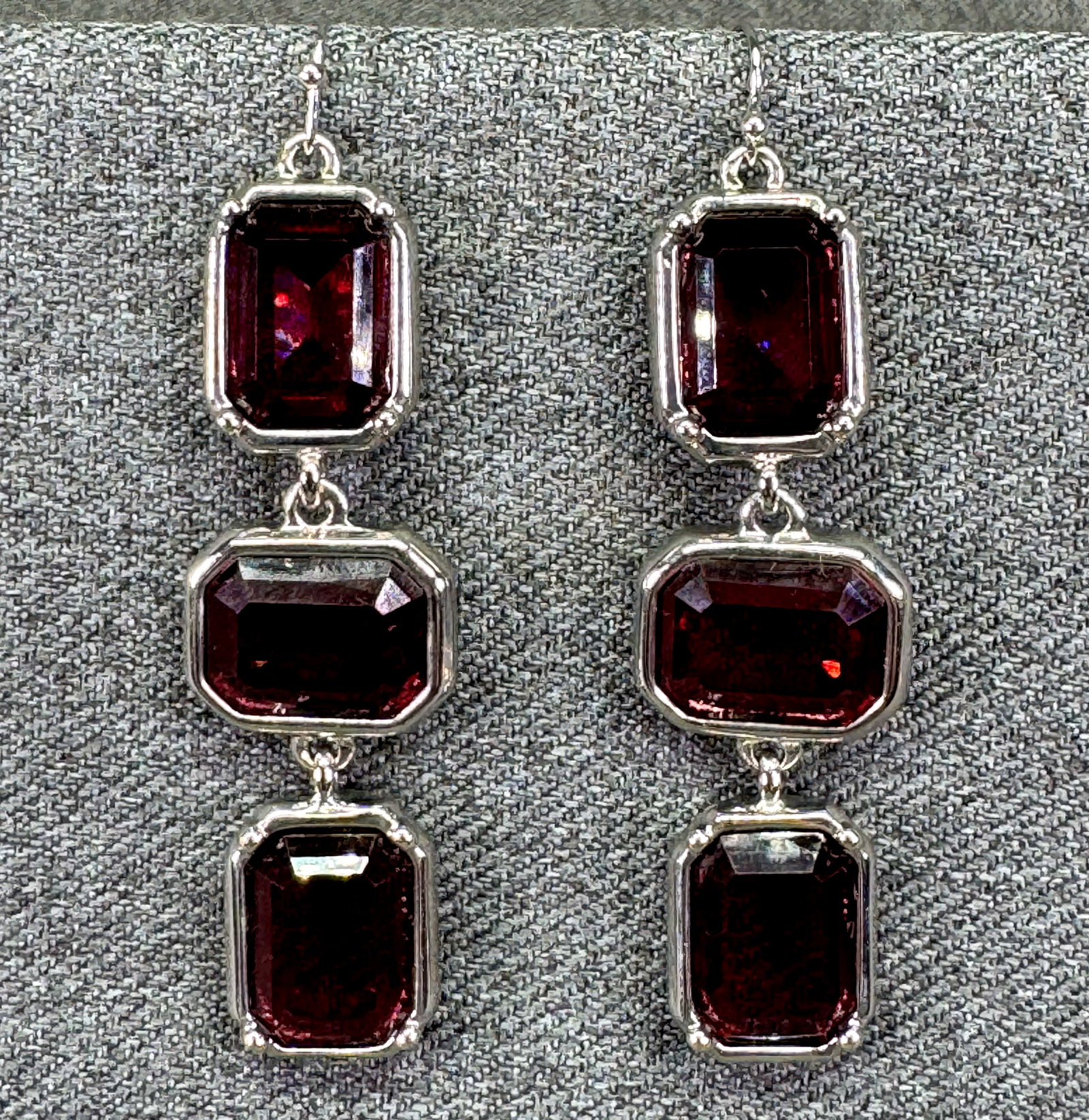 Burgundy Crystal Triple Drop Earrings. Silver-tone. #p: Burgundy Crystal Triple Drop Earrings. Silver-tone. Unmarked. For measures please refer to the pictures taken with a measuring tape. Weight:22 Grams. IN HOUSE FLAT SHIPPING & HANDLING COST WITHIN ALL 