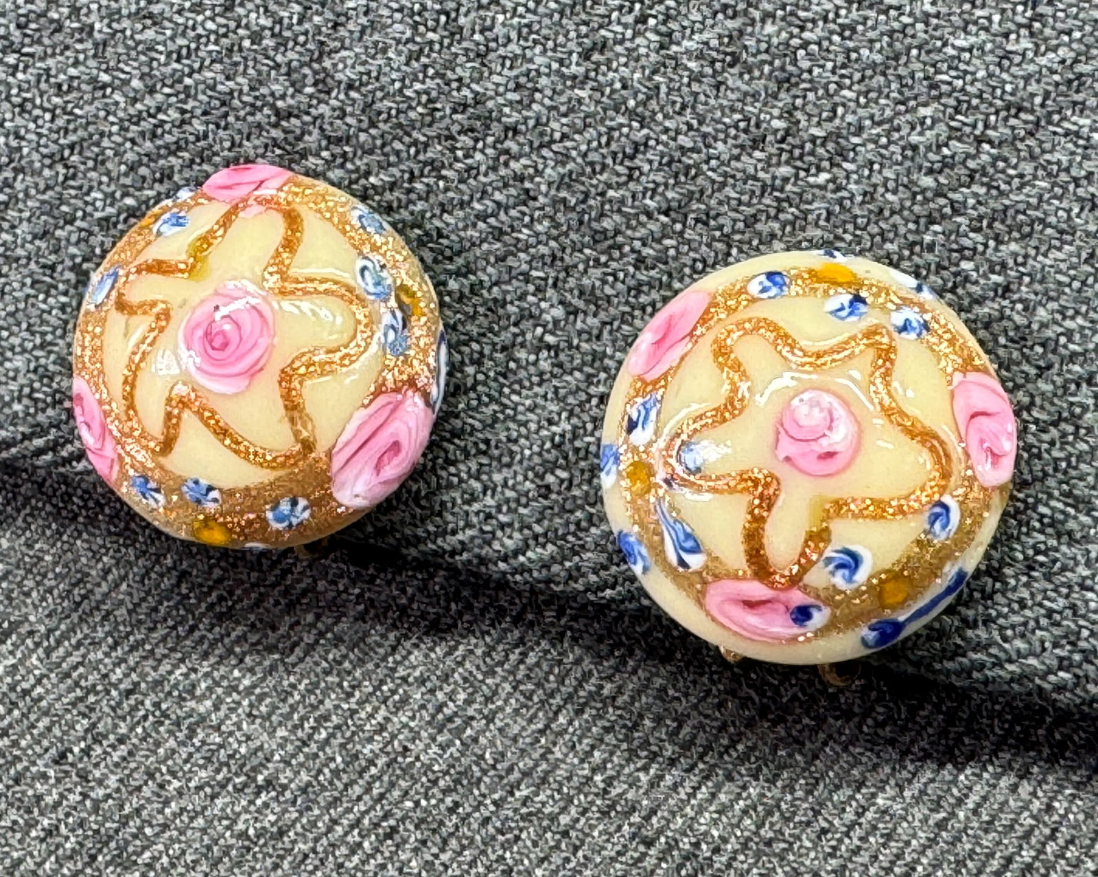 Vintage 1940s Murano Venetian Wedding Cake Round Clip On Earrings. *S: Vintage 1950s Venetian Murano glass clip-on earrings. Hand-decorated cream glass base featuring pink fiorato glass roses, blue forget-me-nots, and aventurine gold glitter swirls. Unmarked. For measure