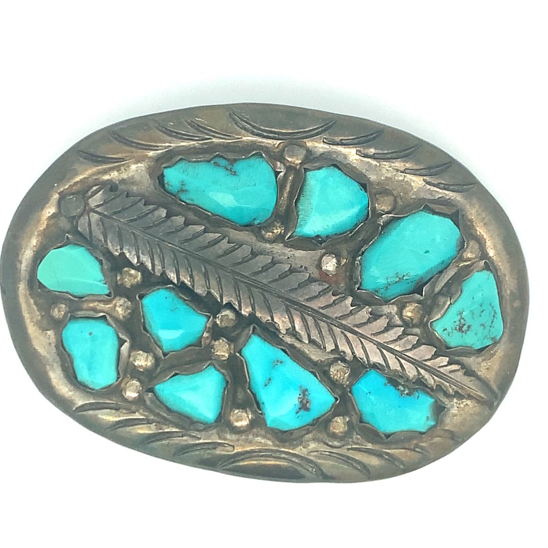 ZUNI NATIVE AMERICAN TURQUOSE STERLING SILVER BELT BUCKLE: ZUNI NATIVE AMERICAN TURQUOSE STERLING SILVER BELT BUCKLE SIGNED ANGIE C. FEATURING 10 TURQUISE GEMSTONES SET IN STERLING SILVERMEASURES 75MM X 52.5MMCAN BE POLISHED UPON REQUEST