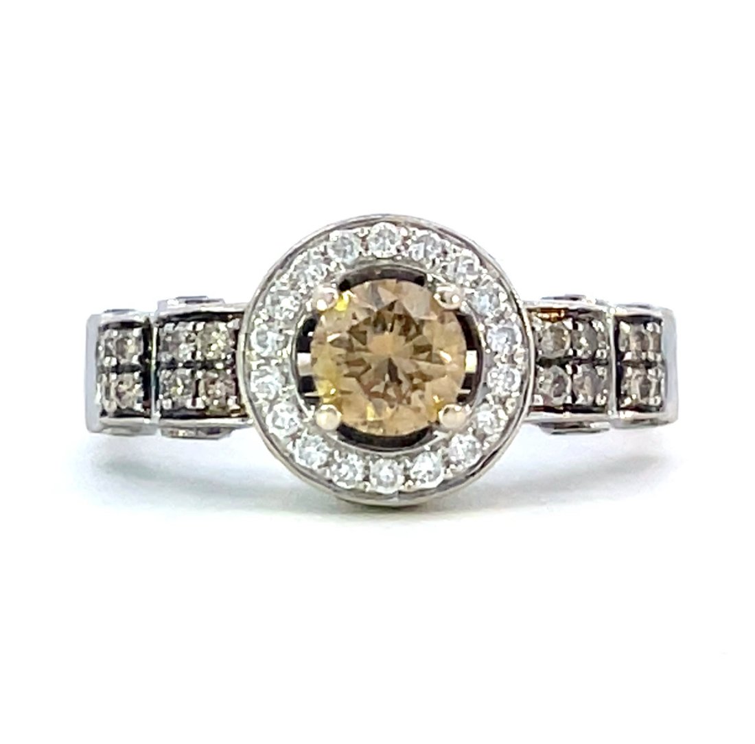 14KT WHITE GOLD Le Vian DIAMOND RING: THIS 14KT WHITE GOLD Le Vian HALO STYLE RING WITH INTRICATE STYLING IS SET WITH 1= 0.65CT ROUND CUT NATURAL DIAMOND OF FANCY BROWN COLOR AND SI2 CLARITY, 19 =0.20CTW ROUND CUT NATURAL DIAMONDS OF G/H