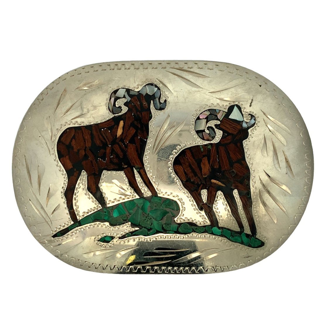 RAM HORN INLAYED BELT BUCKLE: DOUBLE RAM HORN INLAYED BELT BUCKLE INLAY CONSISTS OF MALACHITE, WOOD, AND ABLALONE. MEASURES 3 3/4" X 2 5/8"