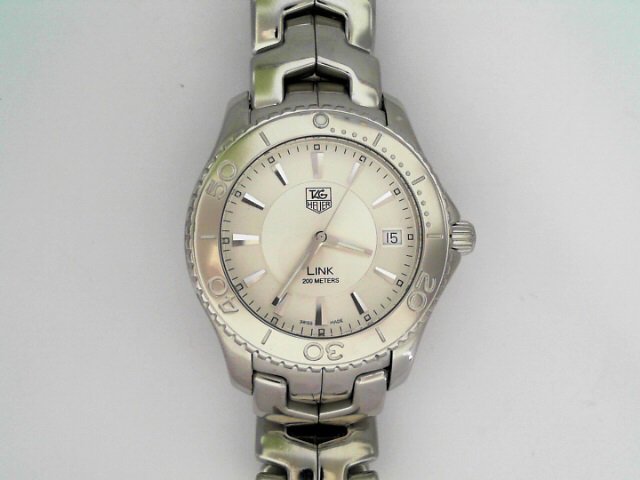 TAG HEUER LINK WATCH: PREOWNED TAG HEUER "LINK" MODEL WJ111, 39MM CASE, STAINLESS STEEL WATCH WITH QUARTZ MOVEMENT. WATCH FEATURES A SLICK SILVER DIAL WITH STAINLESS UNIDIRECTIONAL BEZELWATCH ONLY. FITS A 7" WRIST.