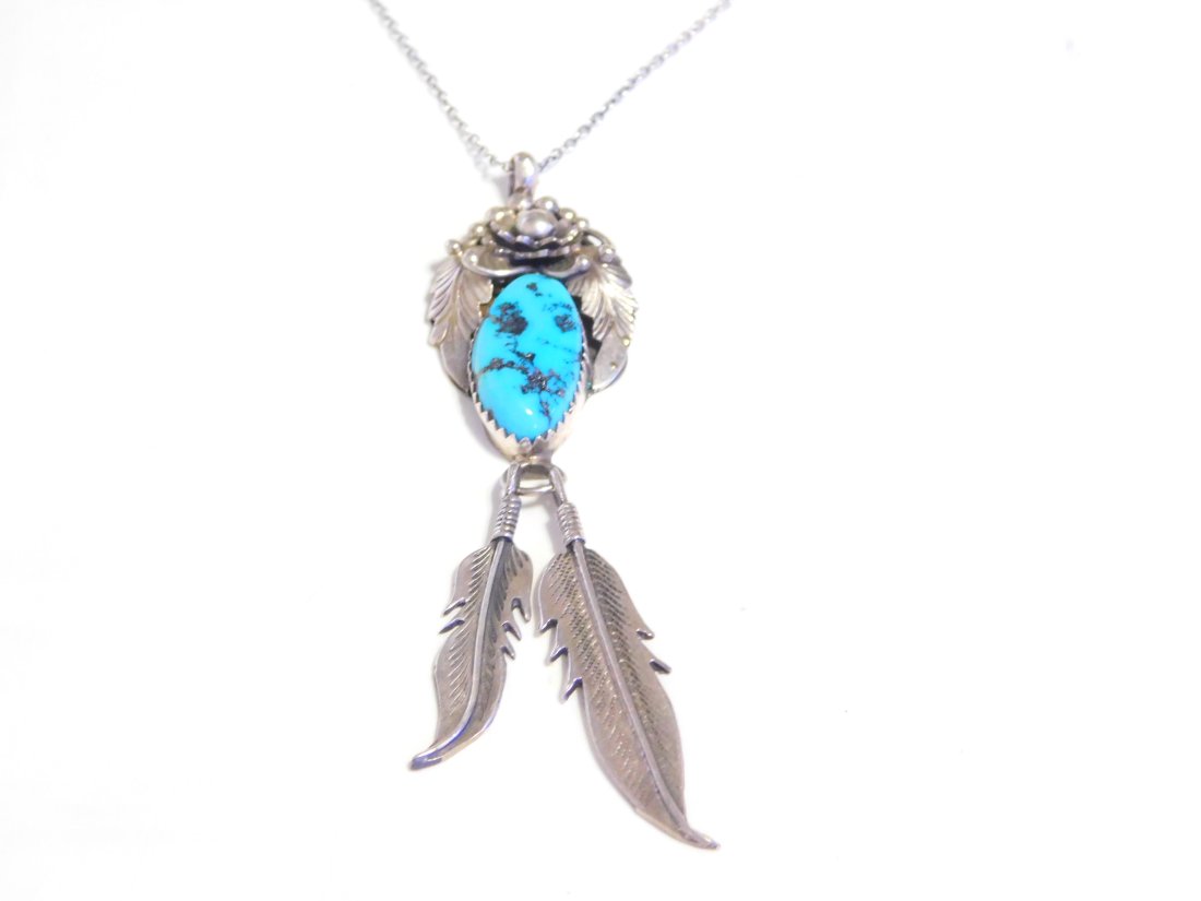 Navajo Sterling Silver Flower Leaf/Feather Turquoise Drop Necklace N211: For Sale is a Vintage Navajo Sterling Silver Flower and Leaf Design Turquoise Pendant with Dangle Silver Feathers Necklace.This Measures 18" in Length and has aa Total Weight of 9.6 Grams.
