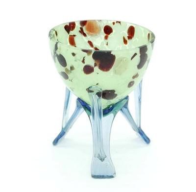 ART DECO FRANZ WELZ SPATTER BOWL: Art Deco era tripod footed bowl was made in the Czech, Bohemia region in the 1930s, by Franz Weltz. Oxblood and Green Spatter glass bowl on blue strutted legs. 3 3/4" w x 4 3/4" h. Weight 7.1 oz. PROV