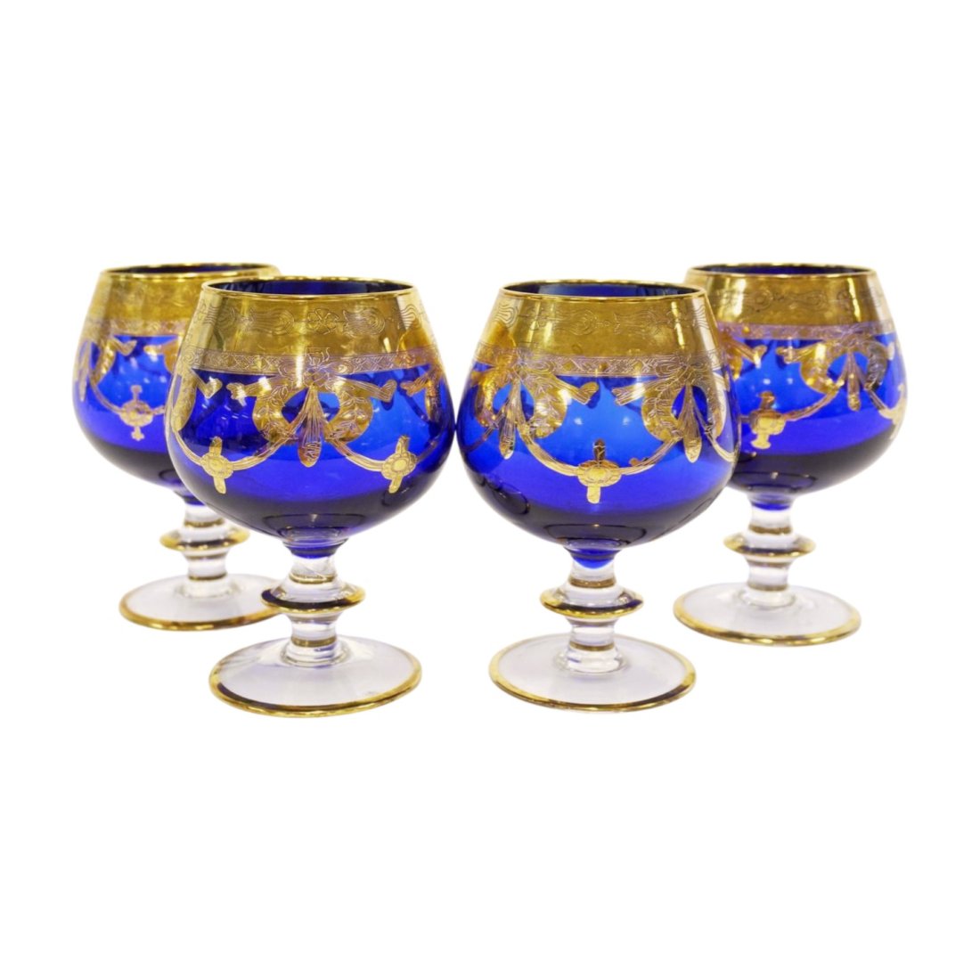 4 ARTE ITALICA GOLD & COBALT BRANDY GLASSES: 4 Arte Italica Gold Encrusted Band and Swags on Cobalt Blue Glass Brandy Glasses. Handmade in Italy. 3.5"x5.75". Weight 2 lbs 8 oz. PROVENANCE: A Charleston SC Private Collection