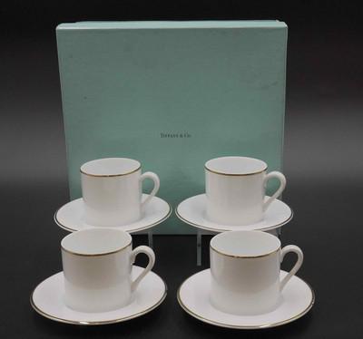 TIFFANY & CO DEMITASSE SET FOR 4: Tiffany and Co. White Bone China with Gold trim Demitasse Espresso Set - Service for 4 The entire set is like new and shows no use. The cups are 2-1/2" inches tall and 2-3/4" diameter. The saucers are