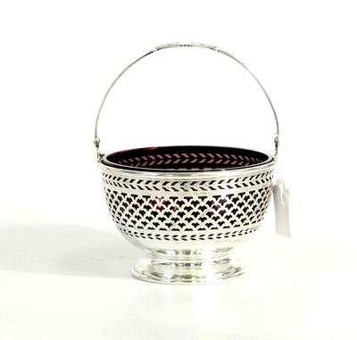 ANTIQUE WATSON STERLING SILVER SUGAR BASKET: American Sterling Silver Swing Handle Pierced Sugar Basket with Amethyst Glass Liner. 4.25"x6". 9 oz including liner PROVENANCE: A Charleston SC Private Collection