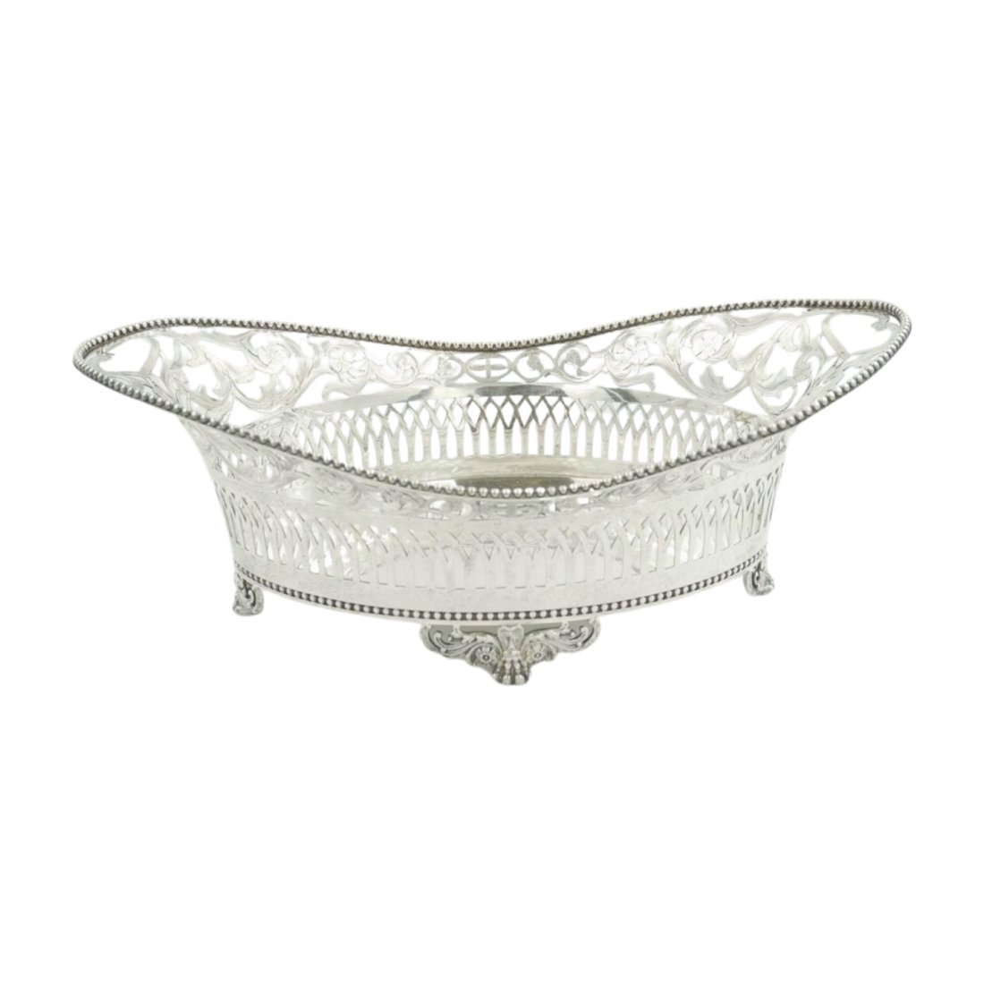 ANTIQUE 19th c TIFFANY STERLING BASKET: Antique Classical sterling silver basket, made by Tiffany & Co. in New York ca 1892. Solid oval well. Sides open with arcade surmounted by floral scrollwork and oval scroll end handles. Asymmetrical r