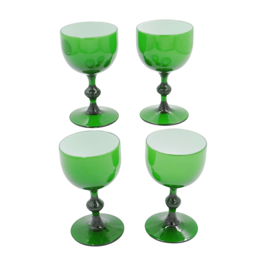 CARLO MORETTI GREEN WINE GLASSES: 4 mid century modern green with white cased glass wine glasses by Carlo Moretti, Italy. Each measures 4 1/4" tall and 2 3/4" in diameter at the top. Weight 1 pd 2 oz. PROVENANCE: A Charleston SC Priva
