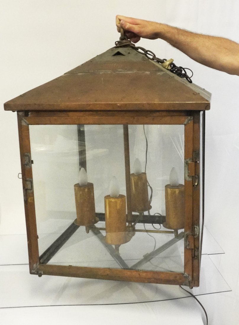 LARGE ANTIQUE COPPER LANTERN: Large Antique English Architectural Copper and Glass Lantern. 4 candle fixture, electrified. 24"x24"x38" PROVENANCE: A Charleston SC Private Estate.