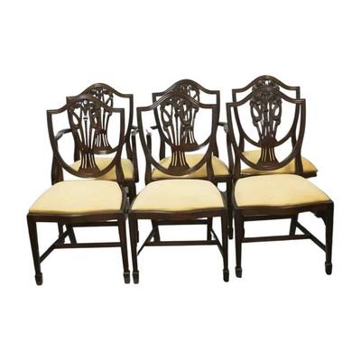 SET OF 6 SHIELD BACK MAHOGANY DINING CHAIRS: Set of 6 shield back carved mahogany dining chairs with Fleur de lis. 2 Arm Chairs and 4 Side Chairs. 20" wide 18" deep 38" tall. 17.5" to top of seat. PROVENANCE: The Historic Clelia Peronneau McGowa