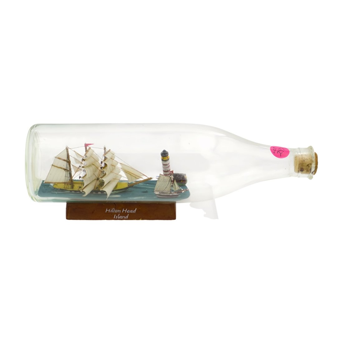 VINTAGE HILTON HEAD SHIP IN A BOTTLE: Vintage Hilton Head Island Ship in a Bottle with Clipper Ship, Sailboat and Lighthouse. 11" long x 3.5" tall Weight 1 pd 6 oz. PROVENANCE: A Charleston SC Estate.