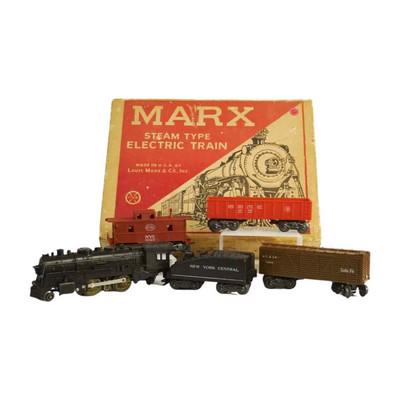 VINTAGE MARX & CO TRAIN SET: Vintage 1940-50s MARX & CO 1666 Steam LOCOMOTIVE W/ Tender, 2 Cars and Caboose. With tracks. All in Original box. In box 13.50"x17.0"x3.40". Weight 8 pds. PROVENANCE: A Charleston SC Private Estate.
