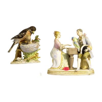 2 pc PORCELAIN FIGURINES OCCUPIED JAPAN & ROYAL CROWN: Occupied Japan Man, Woman & Parrot at Piano 5.75"x3.50"x5.75" Royal Crown Robin with Babies 5"x3"x5". Weight 1 pd 12 oz.