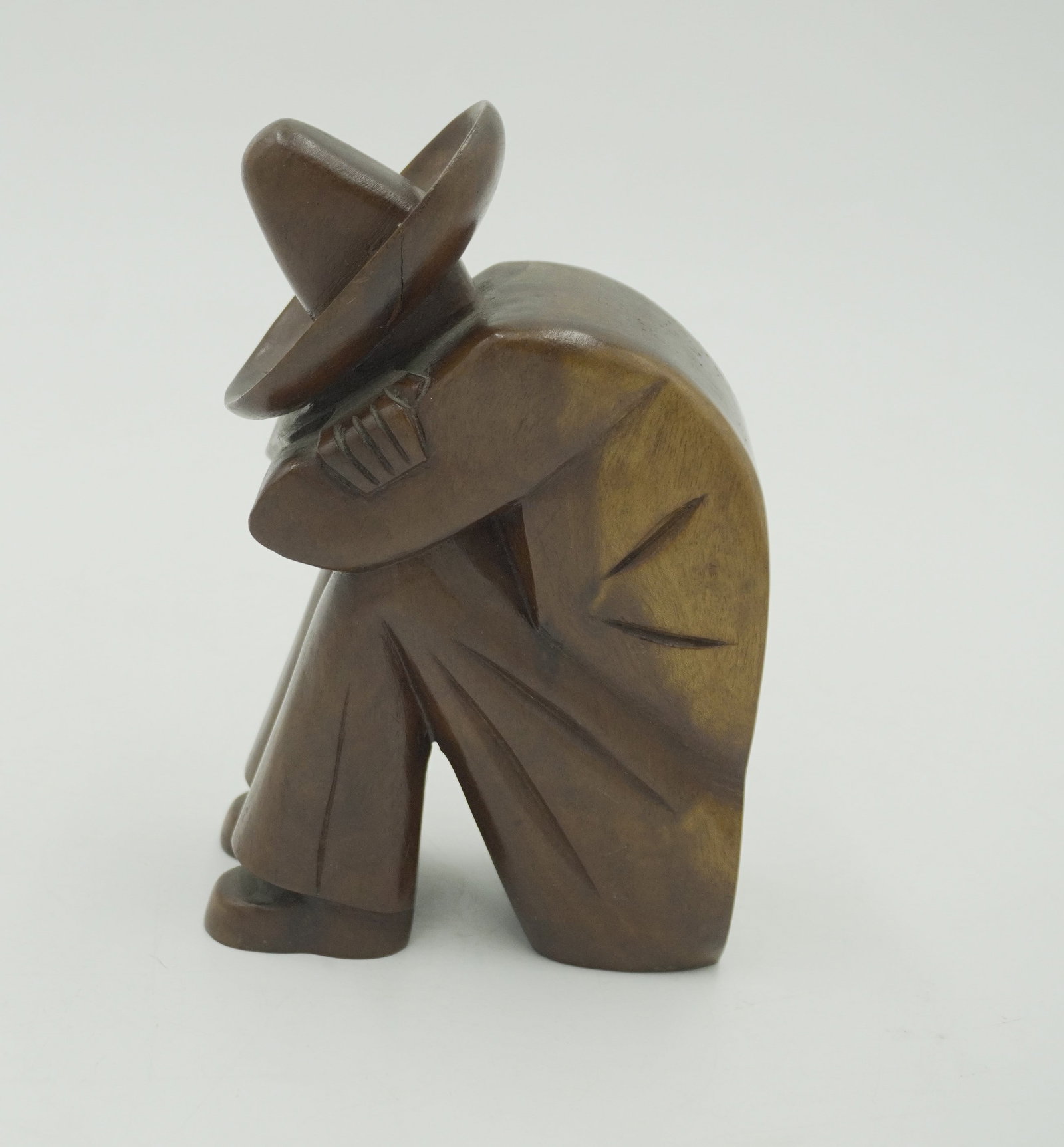 MCM MEXICAN FOLK ART SCULPTURE: MCM Mexican Folk Art Sculpture of a man taking a nap in a sombrero. This piece measures about 7" tall and 4" wide. Total weight is 1 lb 2 oz.