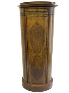 BIEDERMEIER 19th c. DANISH ROUND CABINET: Biedermeier Danish (19th Century) burl walnut tall pedestal cabinet with a large single front door and ebonized banded trim. Label on the back from furniture and cabinet maker A.L. Johansen (Andreas