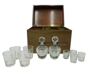 1920s LIQUOR CABINET 2 DECANTERS & 8 GLASSES: 1920s Liquor Cabinet from Texas. Two Cut Crystal Decanters, 4 Shot Glasses and 4 Rock Glasses in Mahogany Case with Brass Handles. Case 9.5"x14"x10.5". Weight 17 lbs, Purchased from the Great Gold Rus