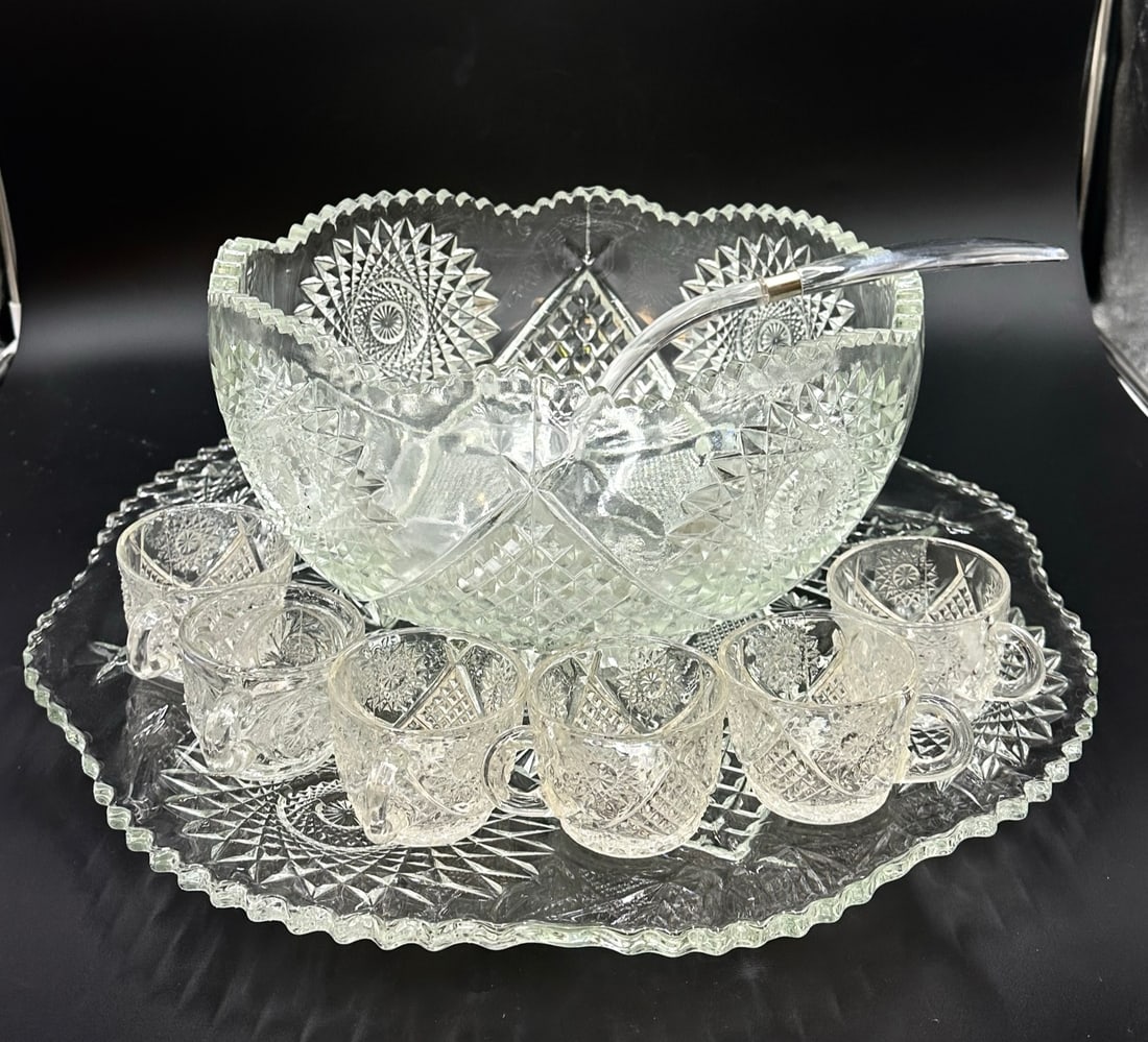 LARGE INDIANA GLASS SARATOGA PUNCH BOWL & UNDERPLATE: Large Indiana Glass Saratoga Punch Bowl and Underplate. With 6 punch cups and Plastic Ladle. Underplate measures 20"x20".Bowl 14"x14"x7". Weight on all 25 pds.