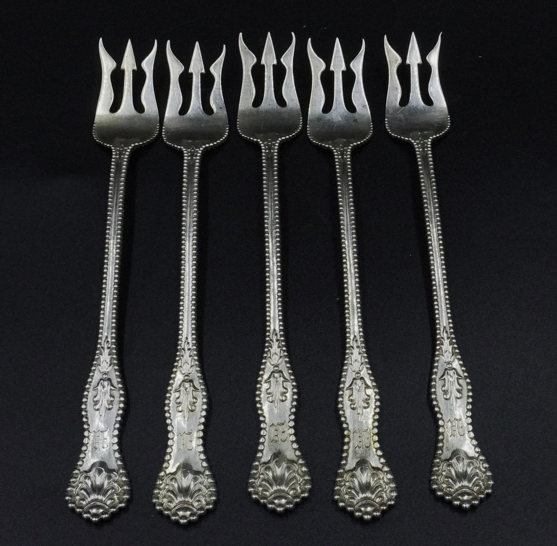 5 STERLING SILVER CHARLES II OYSTER FORKS: 5 Sterling Silver Oyster Forks in the Charles II Pattern by Dominick & Haff. Each 5.5". Weight approximately 88 grams.