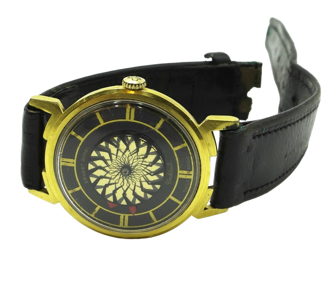 ERNEST BOREL VINTAGE COCKTAIL KALEIDOSCOPE WATCH: Ernest Borel Vintage 1960s Swiss made 17J "Cocktail" gold filled watch. With the mesmerizing kaleidoscope dial, in continuously moving sunburst pattern. 1" in diameter. Skeleton back. Gold-filled. Mec