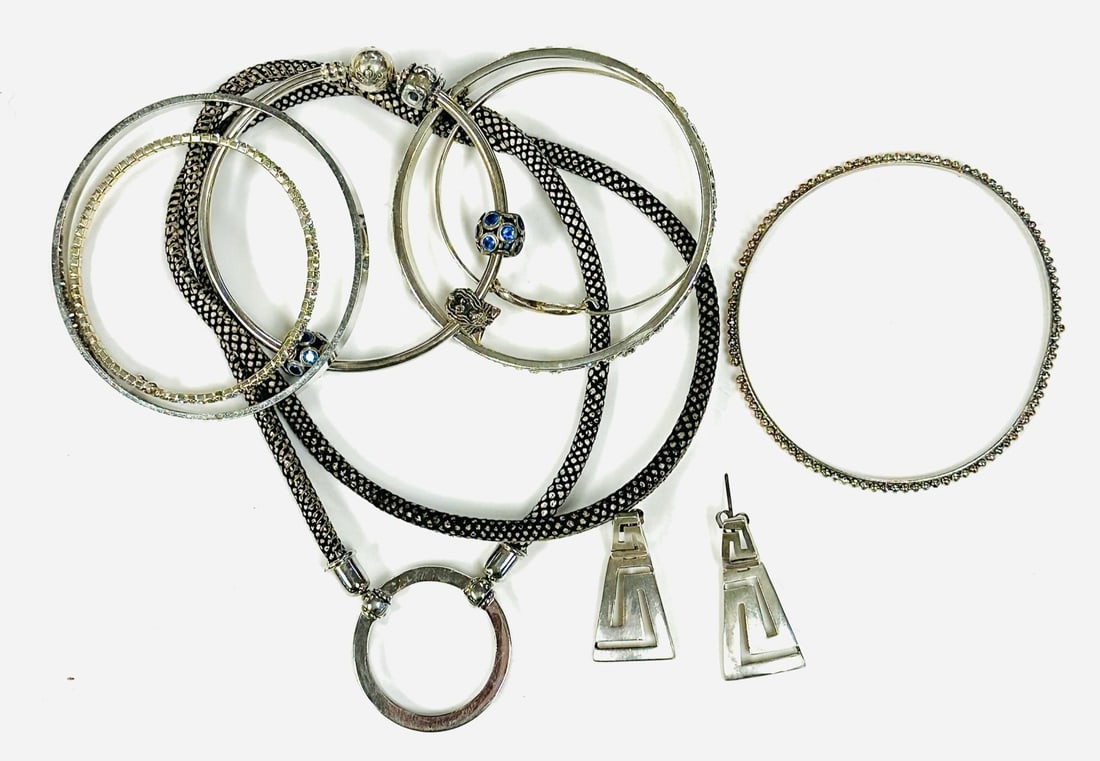 LOT OF SILVER AND COSTUME JEWELRY - 9 PIECES: Lot of costume and silver jewelry including Pandora bracelet and Loop necklace. Total lot weight is 3.3 oz.