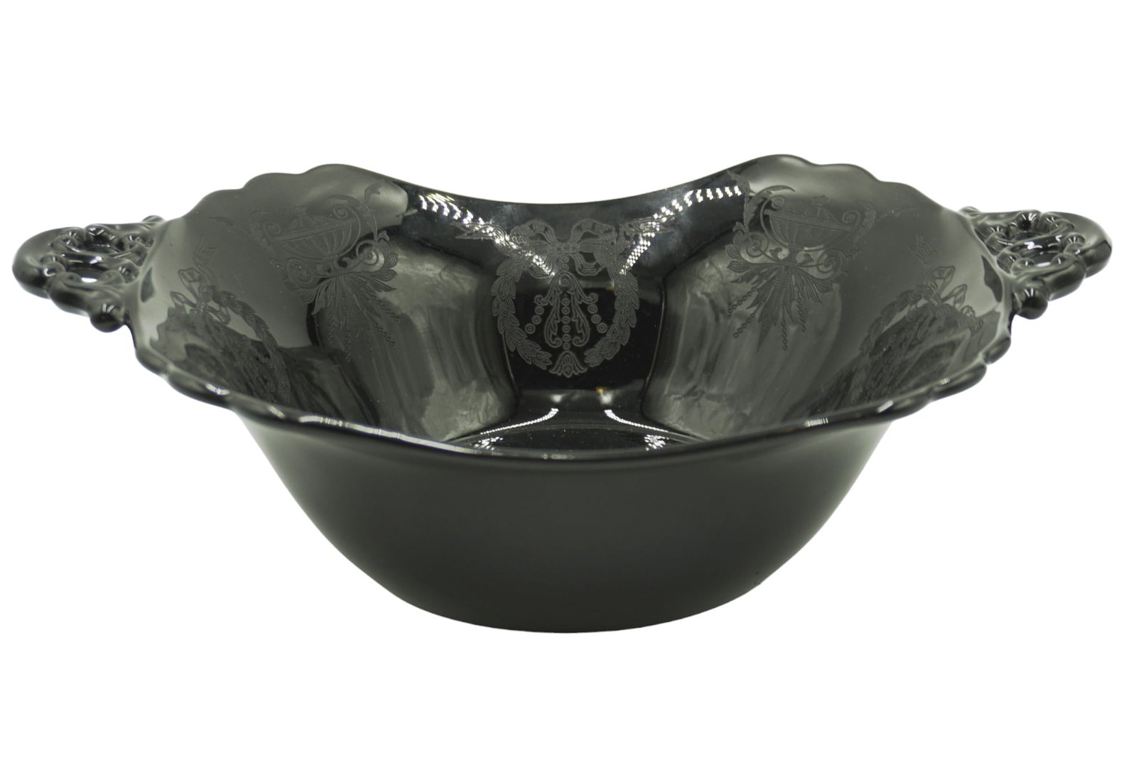 BLACK CAMBRIDGE GLASS BOWL WITH ETCHED ACCENTS: Antique black Cambridge glass bowl with etched details. Measures 12.5" in length, 9" wide, and 3.5" tall. Total lot weight is 2 lbs 7 oz.