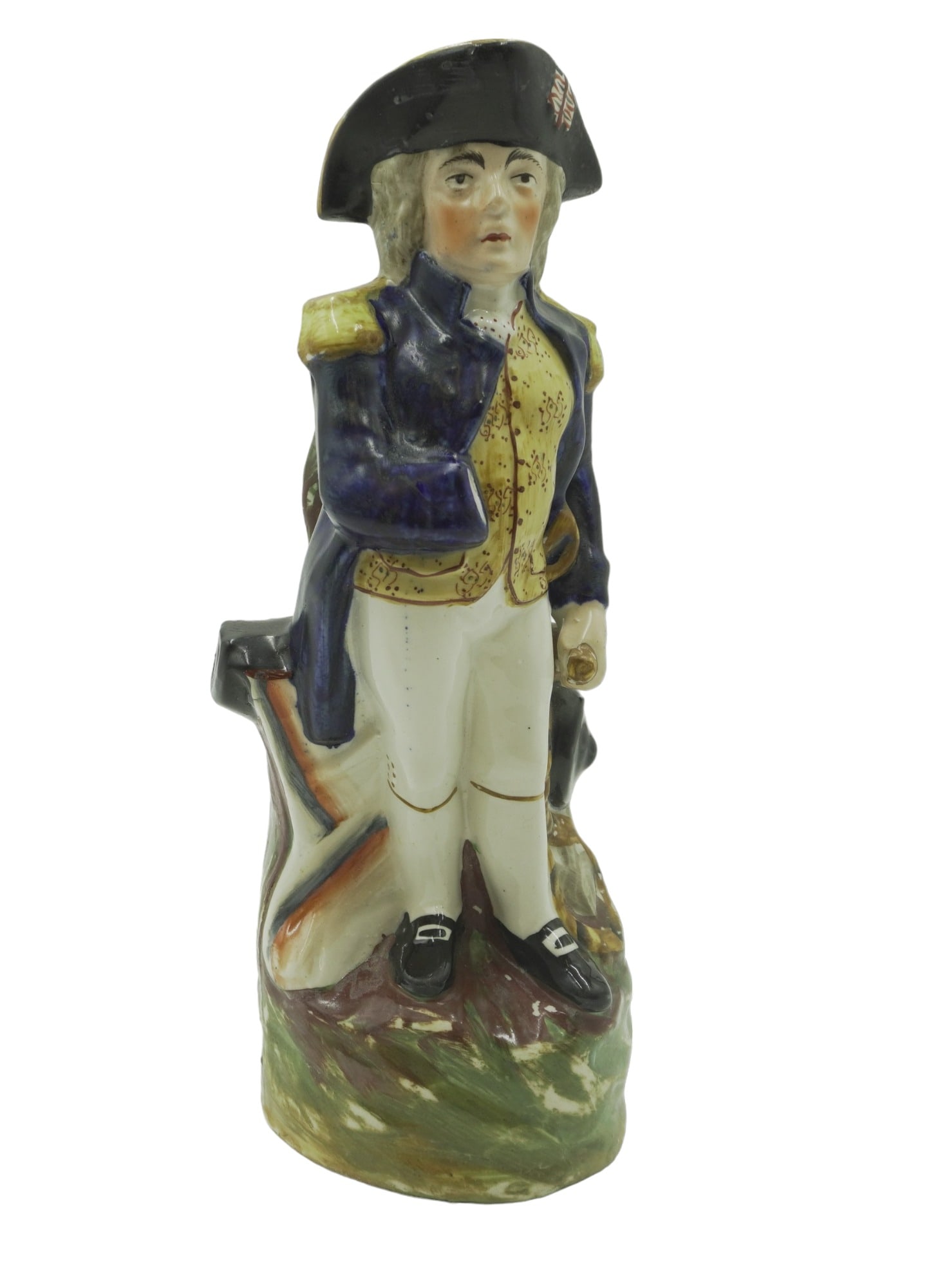 STAFFORDSHIRE NELSON TOBY JUG c 1865: A Staffordshire "Nelson" Toby Jug c. 1865. Modelled as the Vice Admiral standing with right sleeve tucked in, he holds a telescope at his side, painted in colors and set on a grassy base. Measures 5"x