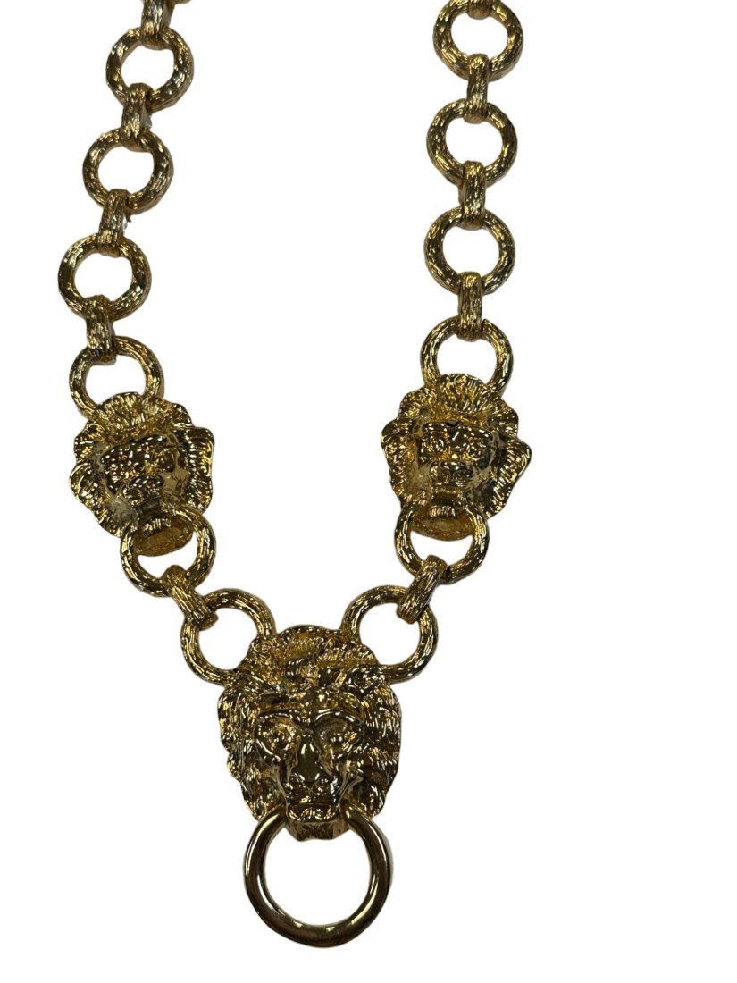 KENNETH J LANE LION NECKLACE KJL: Vintage Kenneth J. Lane Lion Head Doorknocker Necklace. Gold tone. Chain Length 18", Ornament Width 1.25", Ornament Length 2". To Ship 4"x4"x1". Weight 4 oz.