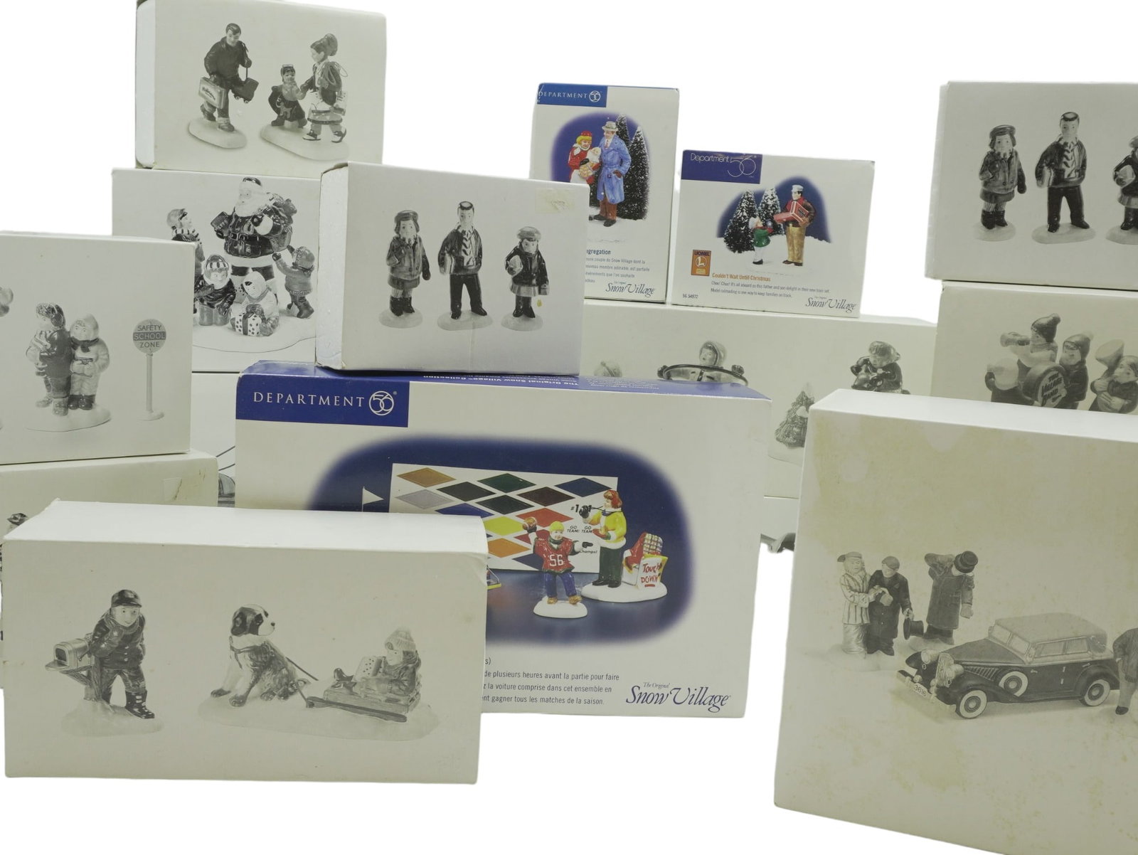 DEPARTMENT 56 "SNOW VILLAGE" ACCESSORIES - 18 PIECES: 18 pieces of Department 56 "Snow Village" accessories and pieces including: Hitch-Up The Buckboard, Terry's Towing (Set of 2), Santa Comes to Town 1995, Steppin Out on The Town, Hayride, Mush (Set of 