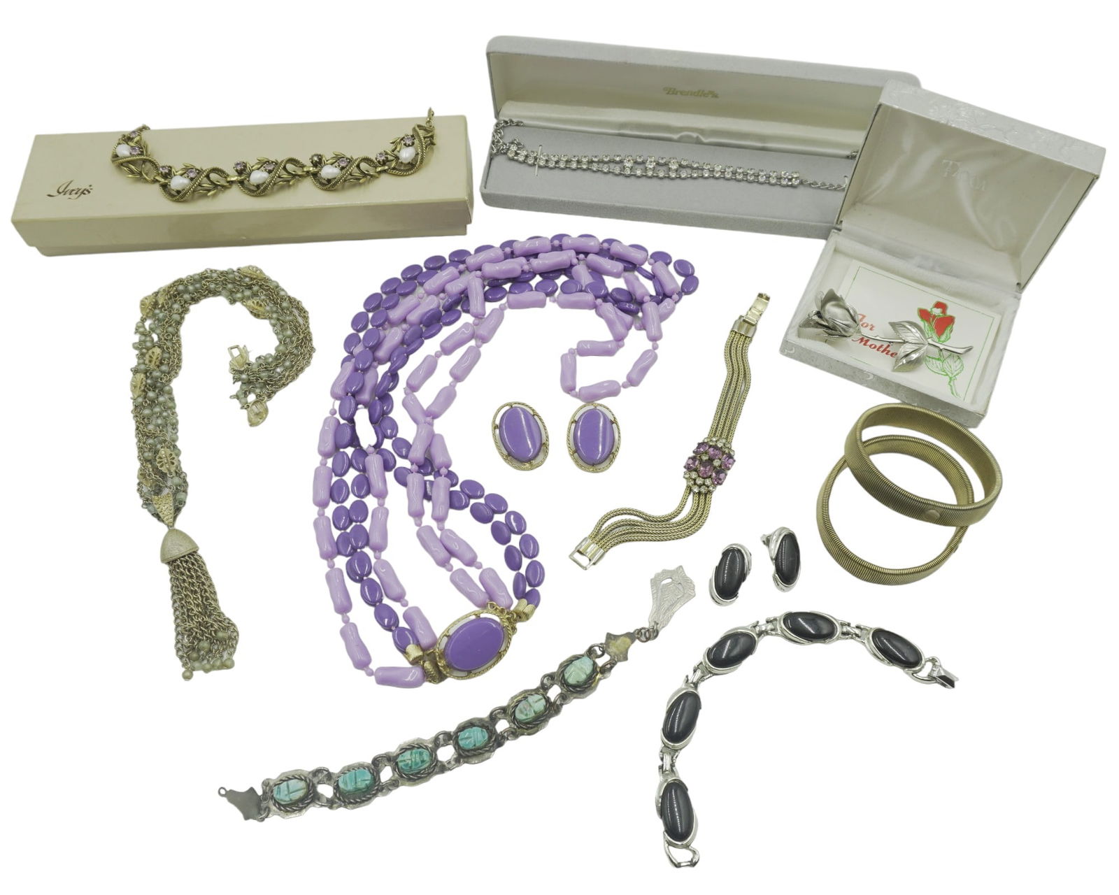 VINTAGE COSTUME JEWELRY: Lot of 8 Vintage Costume Jewelry Including: 1950's Unsigned Coro Station Necklace ( one stone is missing), Retro Purple Lucite Necklace & Clip Earings and more. Total weight
