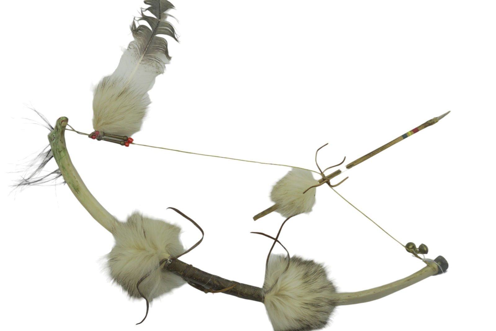 NATIVE AMERICAN CARVED RIB BONE BOW & ARROW: Native American Carved Rib Bone Bow. Carved in the shape of a horse head. Leather, bone, horsehair and fur. 23.5". Weight 1 lb 5 oz.