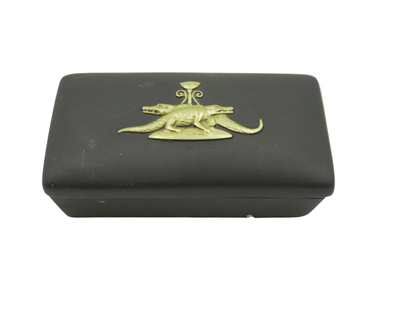 RARE WEDGWOOD BASALT CROCODILE BOX: A rectangular shaped Wedgwood black basalt Jasperware trinket box and lid with detailed Egyptian Crocodile gold detailing c. 1970s. Box measures: 3.5 in. Weight 3.7 oz. PROVENANCE: A Madrid, Spain / C