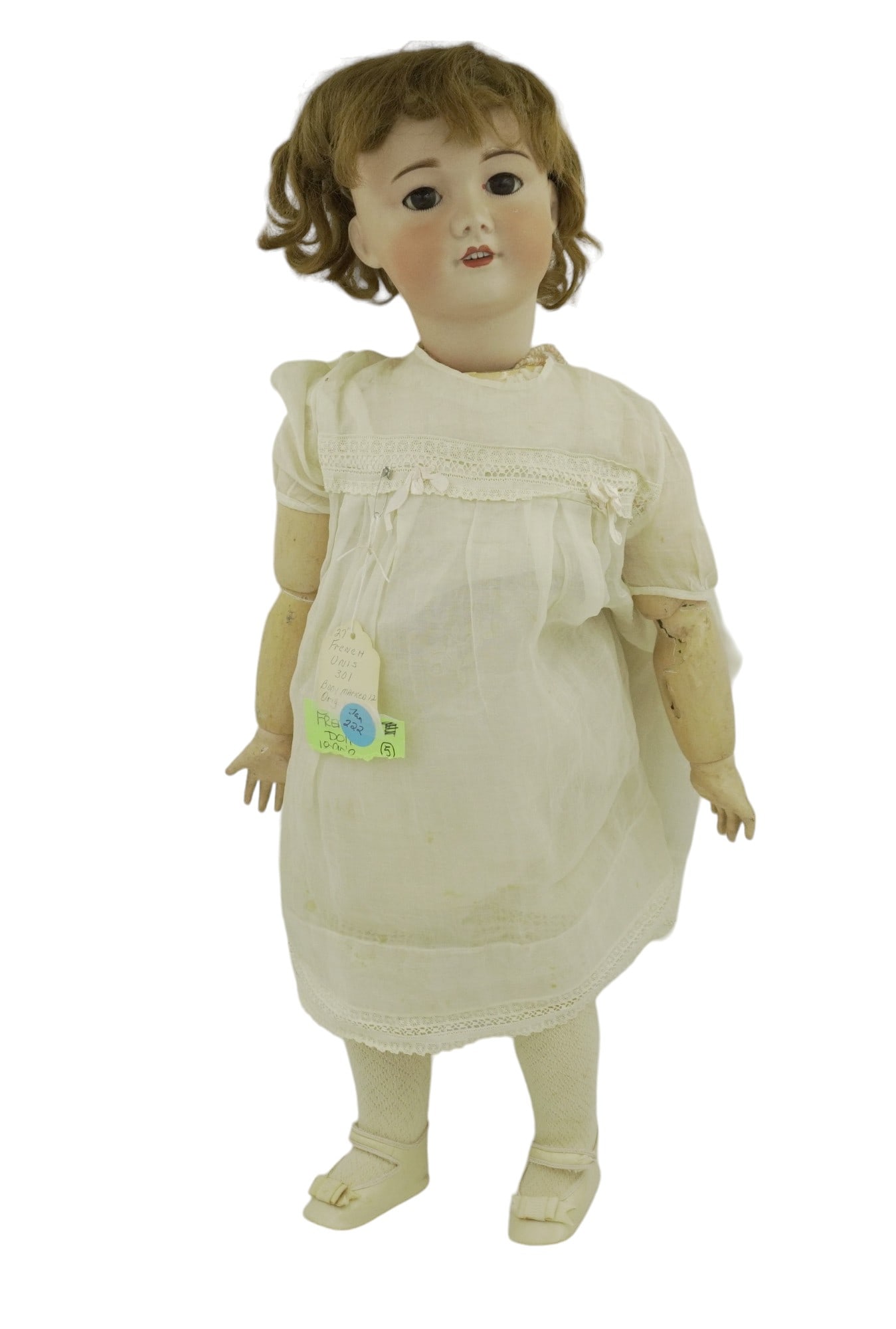 LARGE ANTIQUE FRENCH UNIS BISQUE HEAD DOLL: Large Antique French Bisque Head Doll. Impressed 'Unis France 71 140 301', with original brown wig, closing brown eyes with lashes, open mouth with teeth. Bisque Head, composition jointed body. Good c