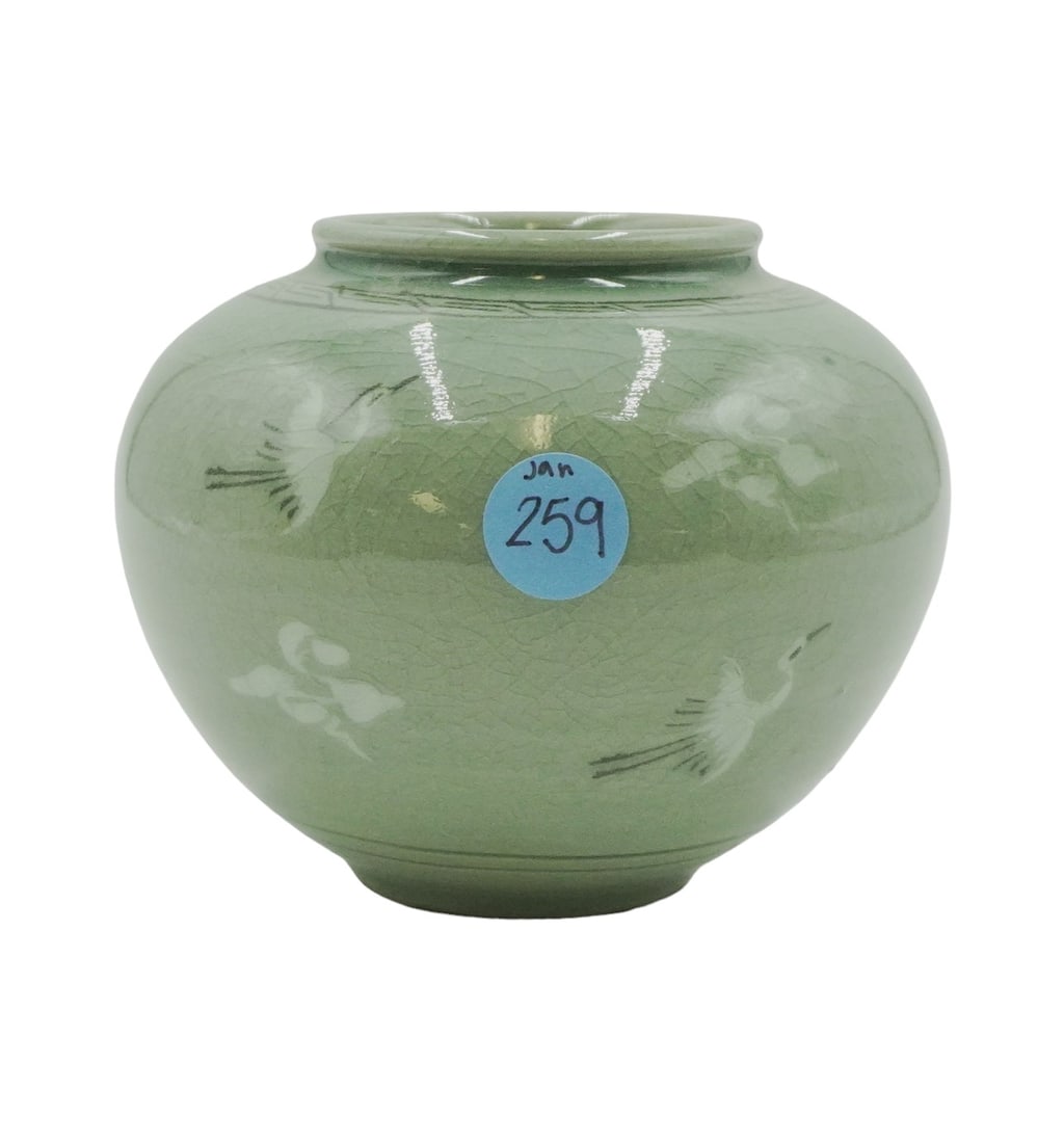 VINTAGE CELADON CRACKLE POTTERY JAR VASE: Vintage celadon crazed crane vase with signature on bottom. Measures 5" wide and 4.5" tall. Weighs 15.3 oz.