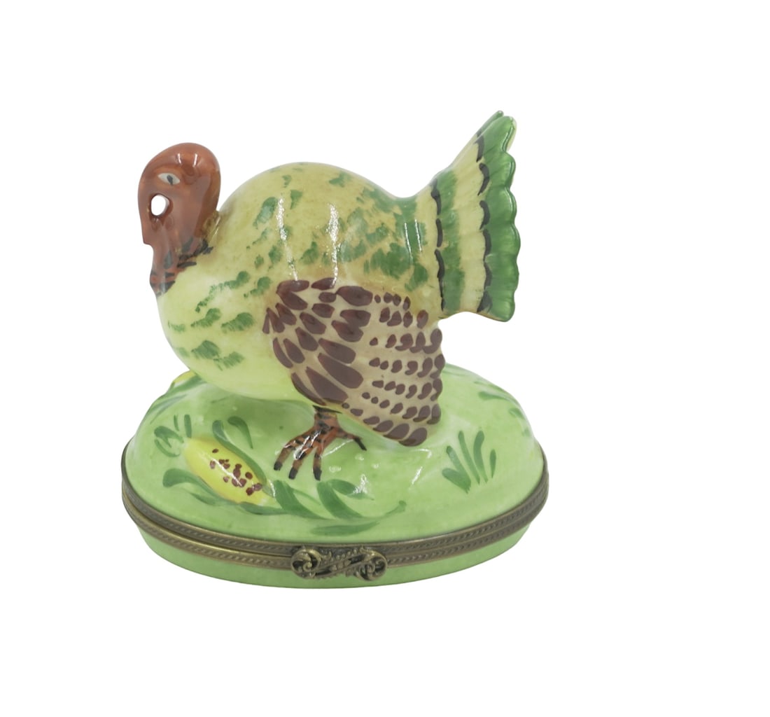 TIFFANY AND CO. TURKEY LIMOGES BOX: Tiffany and Co. Turkey Limoges Box. Hand Painted porcelain from France. Featuring filigree clasp and painted gold design on inside. Signed Tiffany & Co Limoges France Peint Main on bottom. Excellent c