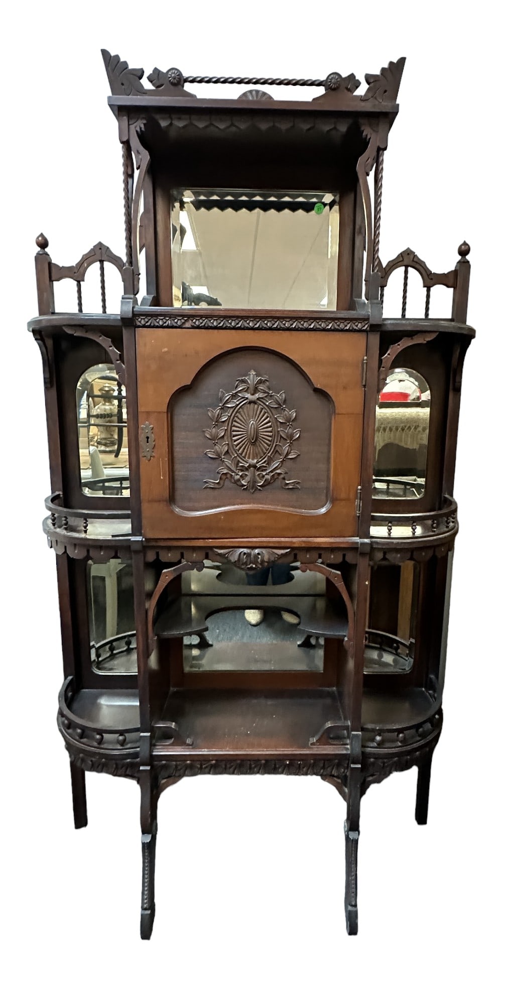 ANTIQUE AMERICAN EASTLAKE MUSIC CABINET / ETAGERE: Antique American Eastlake Music Cabinet / Etagere. Beveled mirrors, carved center cabinet for sheet music and multiple display shelves. Measures 36"x12"x65"