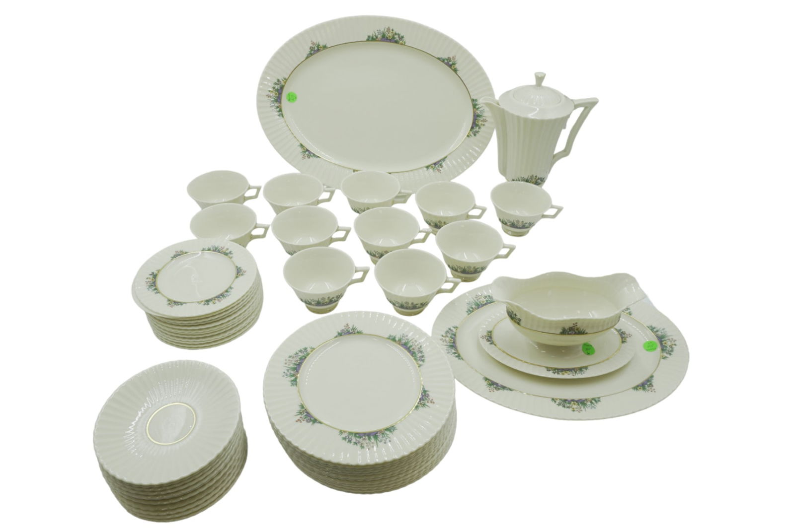 63 PC LENOX RUTLEDGE SRVC FOR 12 PLUS: 63 Piece Vintage Lenox Rutledge China Service for 12 Plus. Enamelled Flowers, Gold Verge &Trim. Excellent Condition. 12 Dinner Plates 11". 12 Salad Plates 8.5". 12 Bread & Butter Plates 6 3/8". 11 Foo