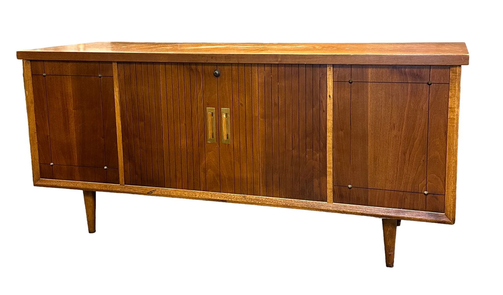 MID CENTURY MODERN LANE CEDAR CHEST: Lane Mid Century Modern Cedar Chest. Cedar chest by Lane in walnut with tapered legs and faux doors tofront. Measures 51.5"x18"x23.5" tall.