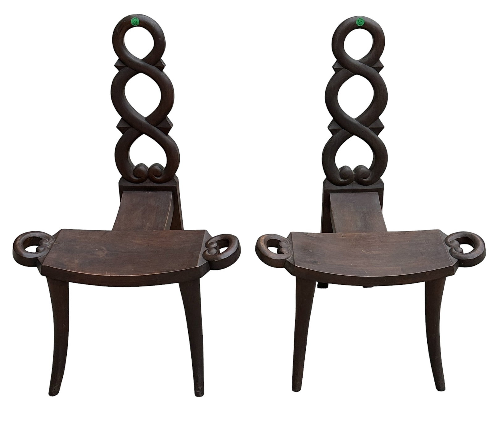 PAIR ANTIQUE CARVED WOOD BIRTHING CHAIRS: Pair of wooden antique birthing chairs with three legs and beautiful details. Size approximations: 29 1/4 inches tall x 20 inches wide x 18 inches deep.