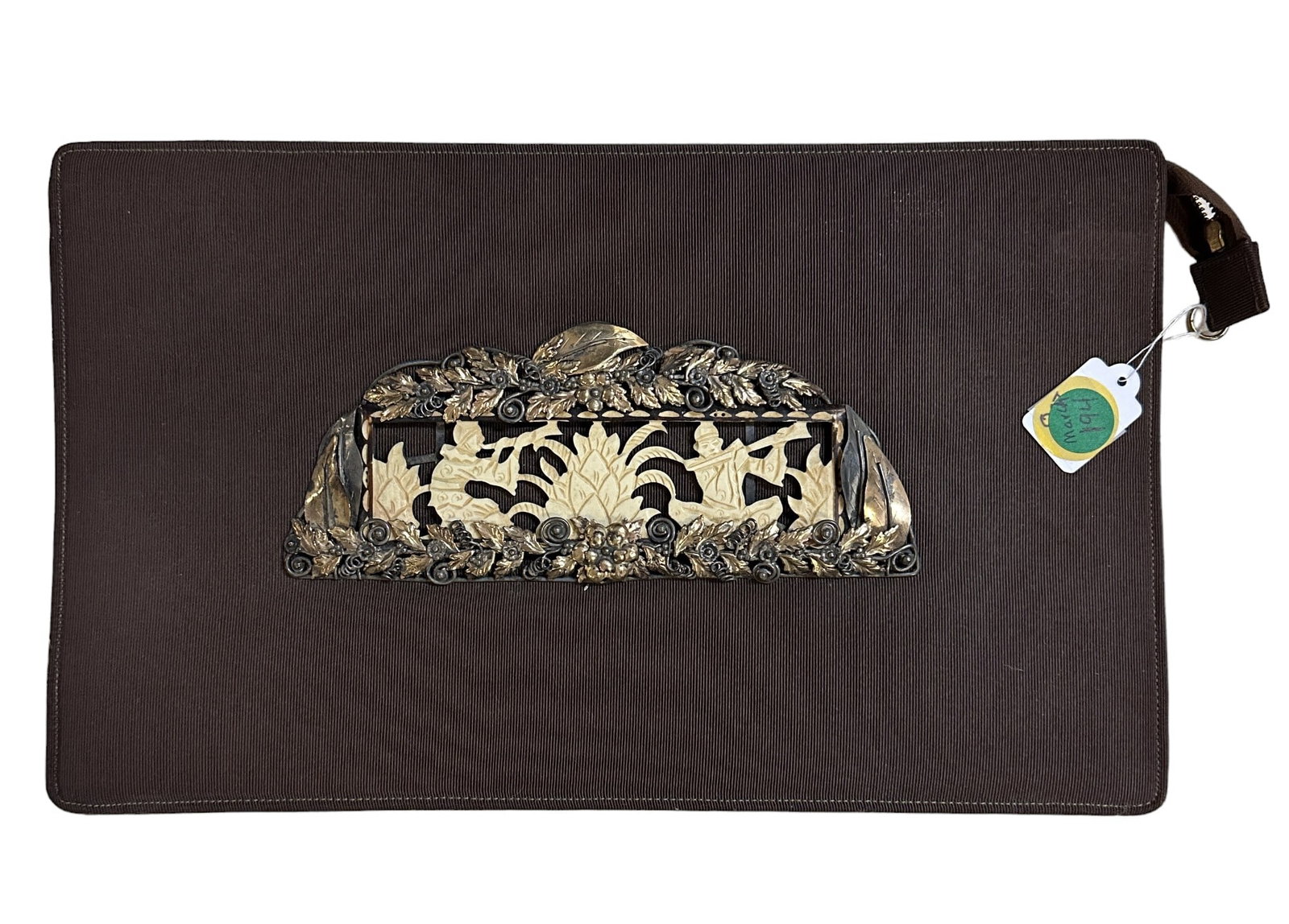 ANTON MORITZ ART DECO CLUTCH: Anton Moritz Art Deco Clutch. Silk with front plaque of carved bone asian musicians surrounded by a frame of silver and gilt foliage. Plaque 7.25"x3". Measures 13"x8"x2". Weight 1 lb