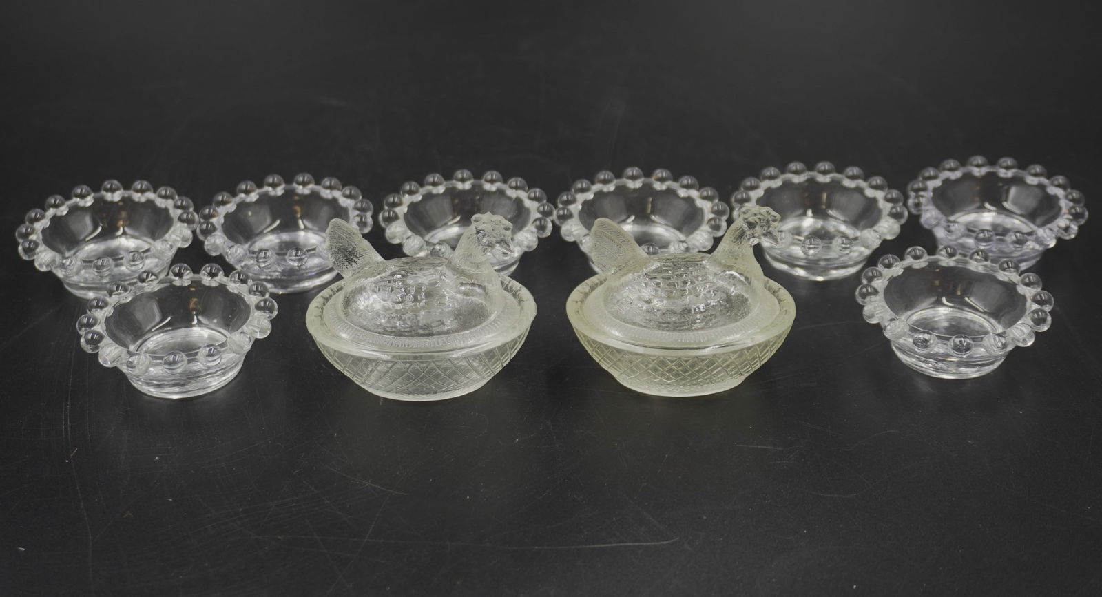 LOT OF VINTAGE SALT CELLARS/DIPPERS - 10 PIECES: 8 vintage Candlewick Imperial glass salt dippers measuring about 1" tall and 2" in diameter and 2 Hen on Nest salt cellars measuring about 2.5" tall, 2.5" wide, and 2" in depth. Total lot weight is 14