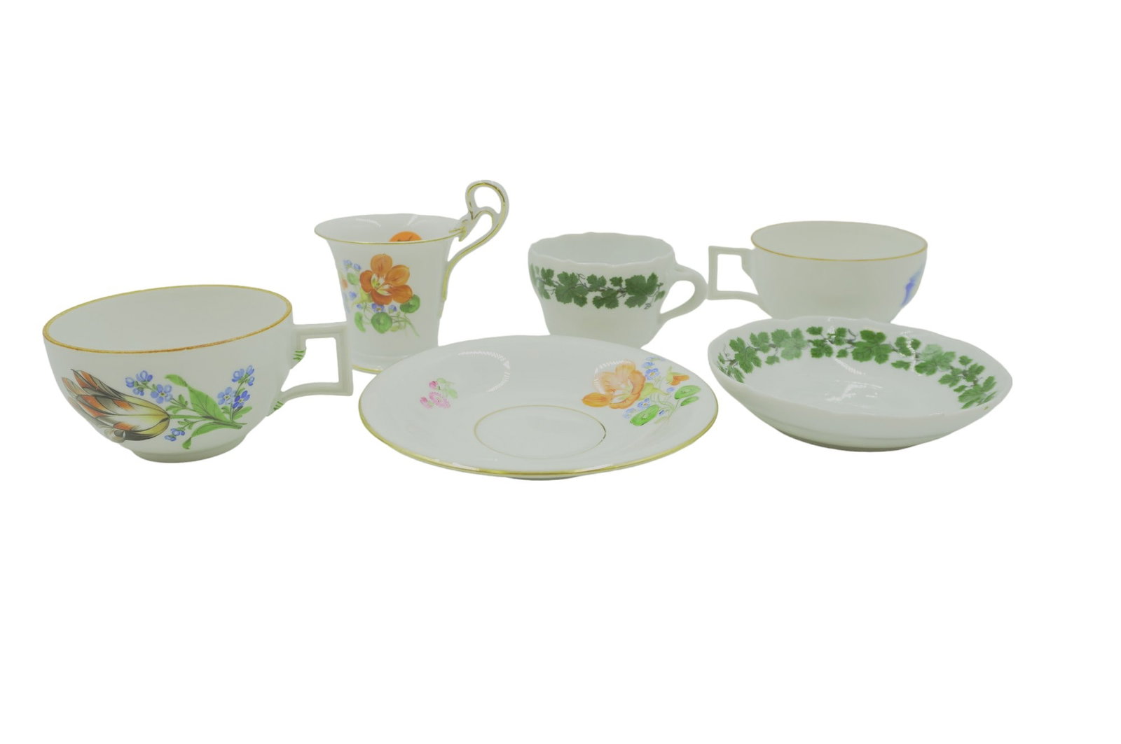 6 PC 18TH & 19TH C MEISSEN CUPS & SAUCERS: Group of 6 Antique Meissen Cups and Saucers. 2 cups from the 18th c. The cup and saucer sets are antique 19th c., early 20th. 1 with swan handle, the other with ivy . Saucers 4.5" and 4", Largest cup 