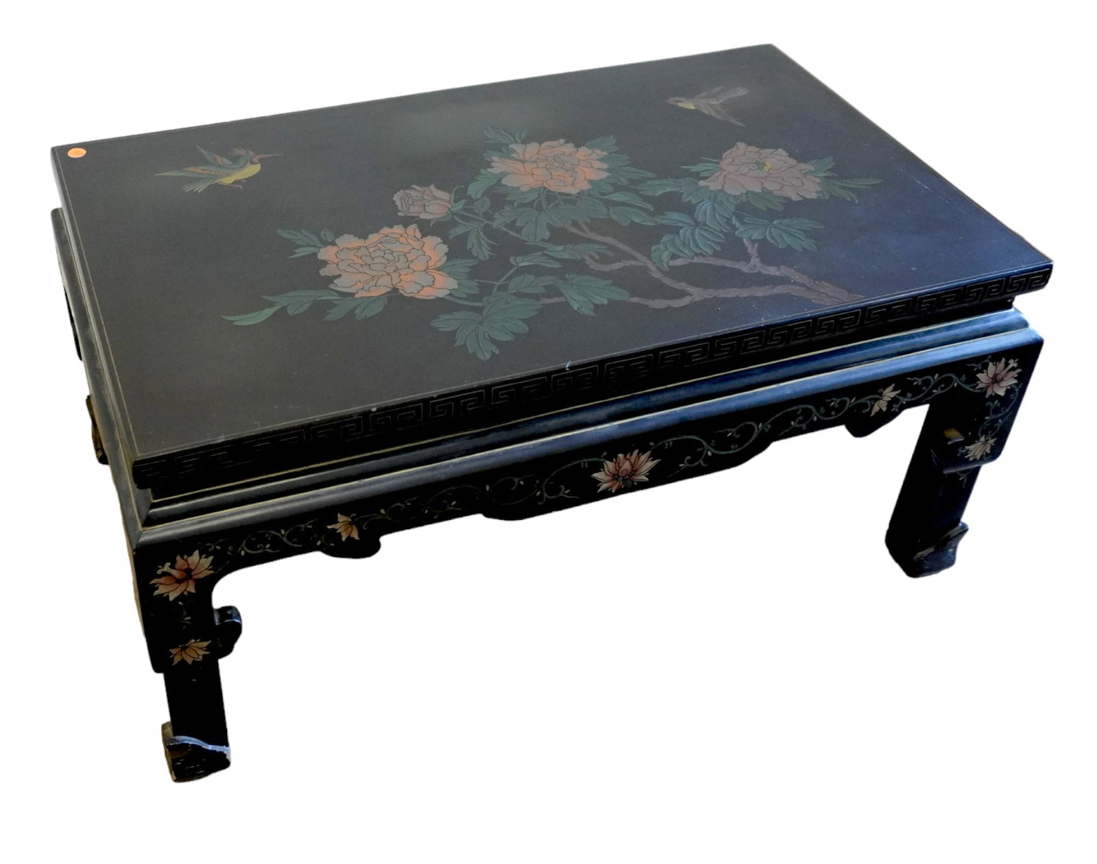 ASIAN BLACK LACQUER COFFEE TABLE: Mid Century Asian Black Lacquer Coffee Table with Carved Painted Birds and Foliage. Measures 36"x21"x18". Weight Approx 50 lbs
