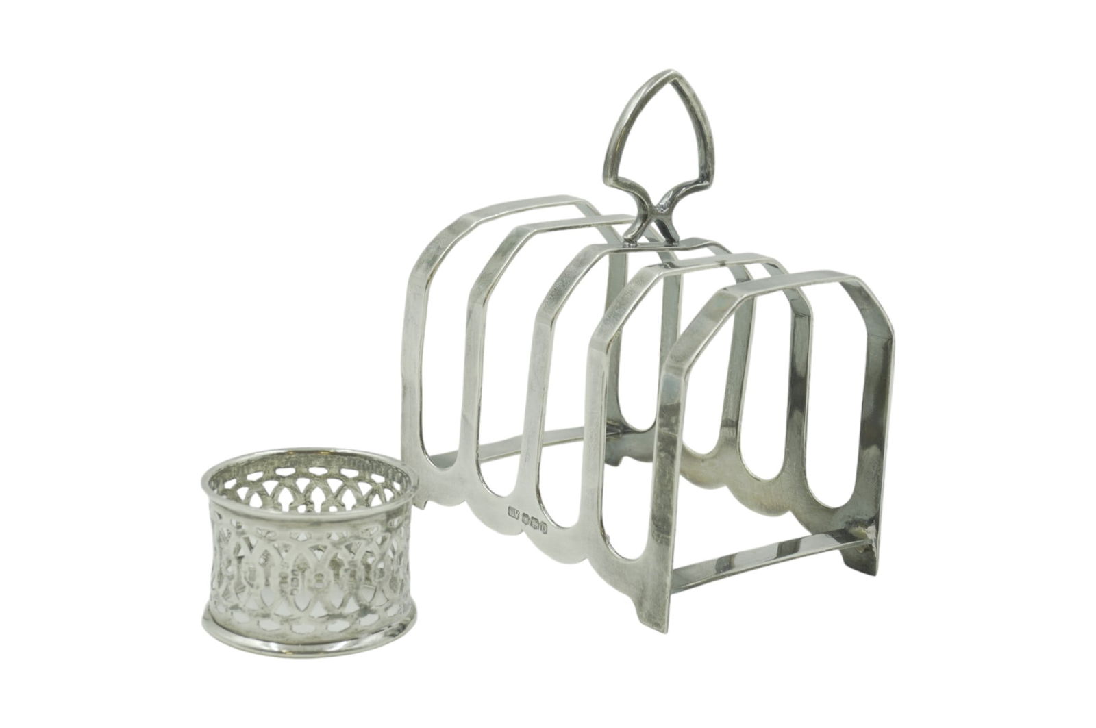 2 PC 19TH C ENGLISH STERLING TOAST RACK + NAPKIN RING: 1 - Viners, Sheffield England Sterling Silver Toast Rack 1881 4"x2.5"x4.25". . 2- John & William Deakin, Sheffield England Pierced Napkin Ring 1 1/8". Approximate silver weight 116 grams.