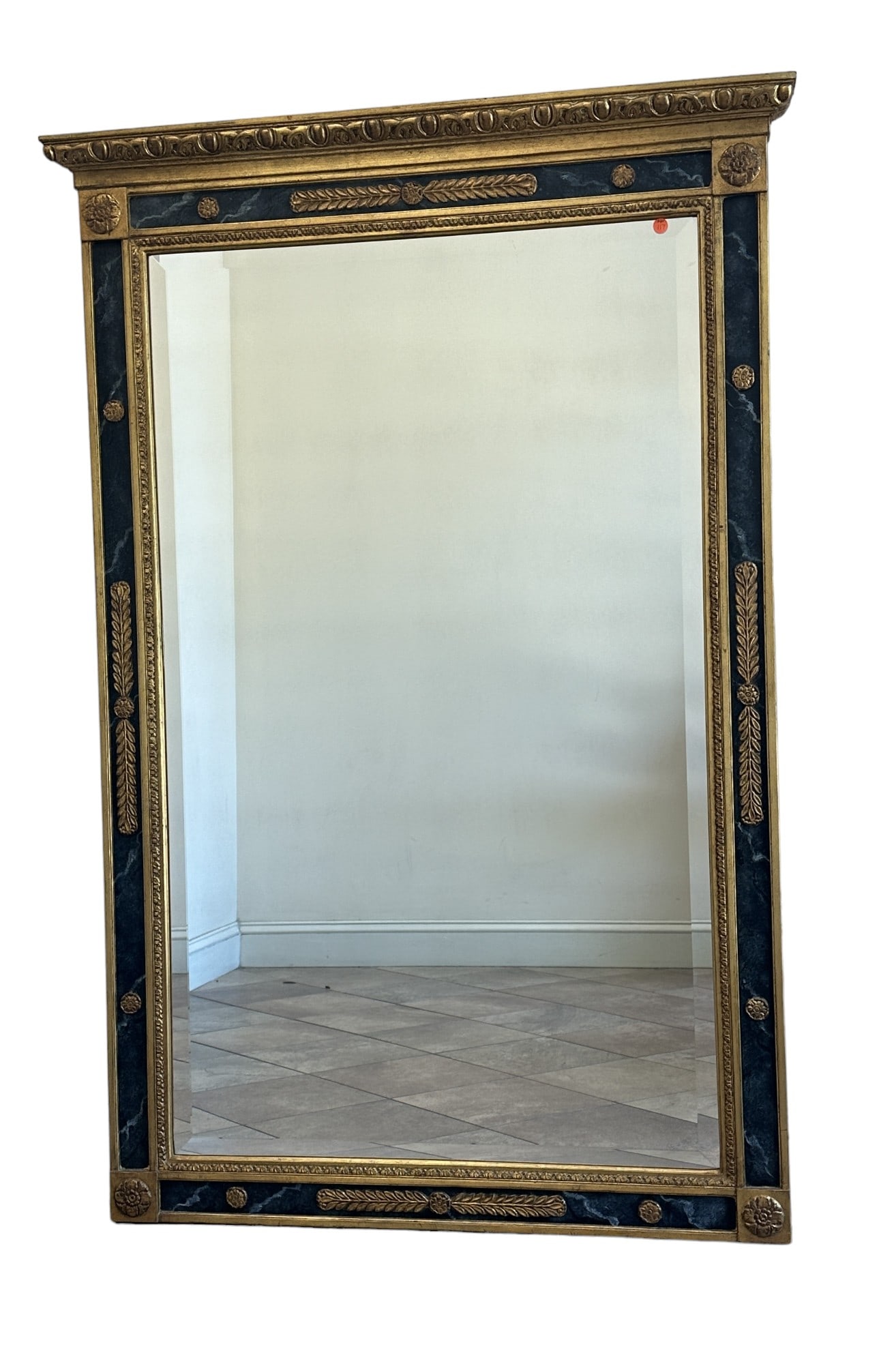 CARVERS GUILD REGENCY TRUMEAU MIRROR: Carvers Guild Regency Trumeau Mirror. Architectural in scale and a grand statement in the neoclassical tradition. Faux black marble panel sets off raised leaf and rosette medallions. Cornice of egg an