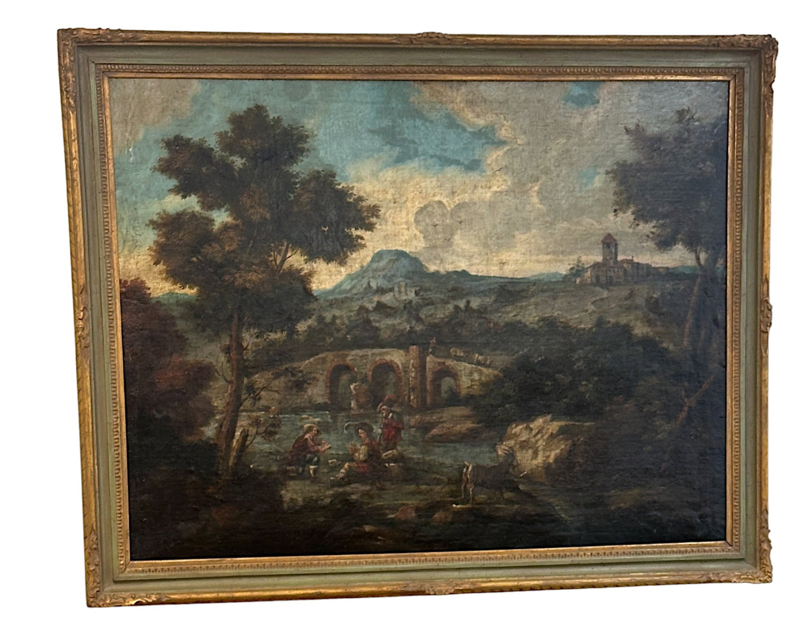 OLD MASTER DUTCH 18TH C OIL ON CANVAS LANDSCAPE: Large Old Master Oil on Canvas 18th c. Landscape with bridge, village, gentlemen playing cards, goat and more. The painting has 2 old patched to back and is in a paint decorated wood frame. In frame 5