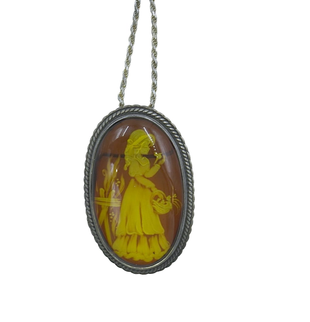 VINTAGE BALTIC AMBER INTAGLIO NECKLACE: Natural Baltic Amber Intaglio Necklace / Brooch . Sterling chain. Pendant 2". Chain 22" Opened. Approximate weight 26 grams.