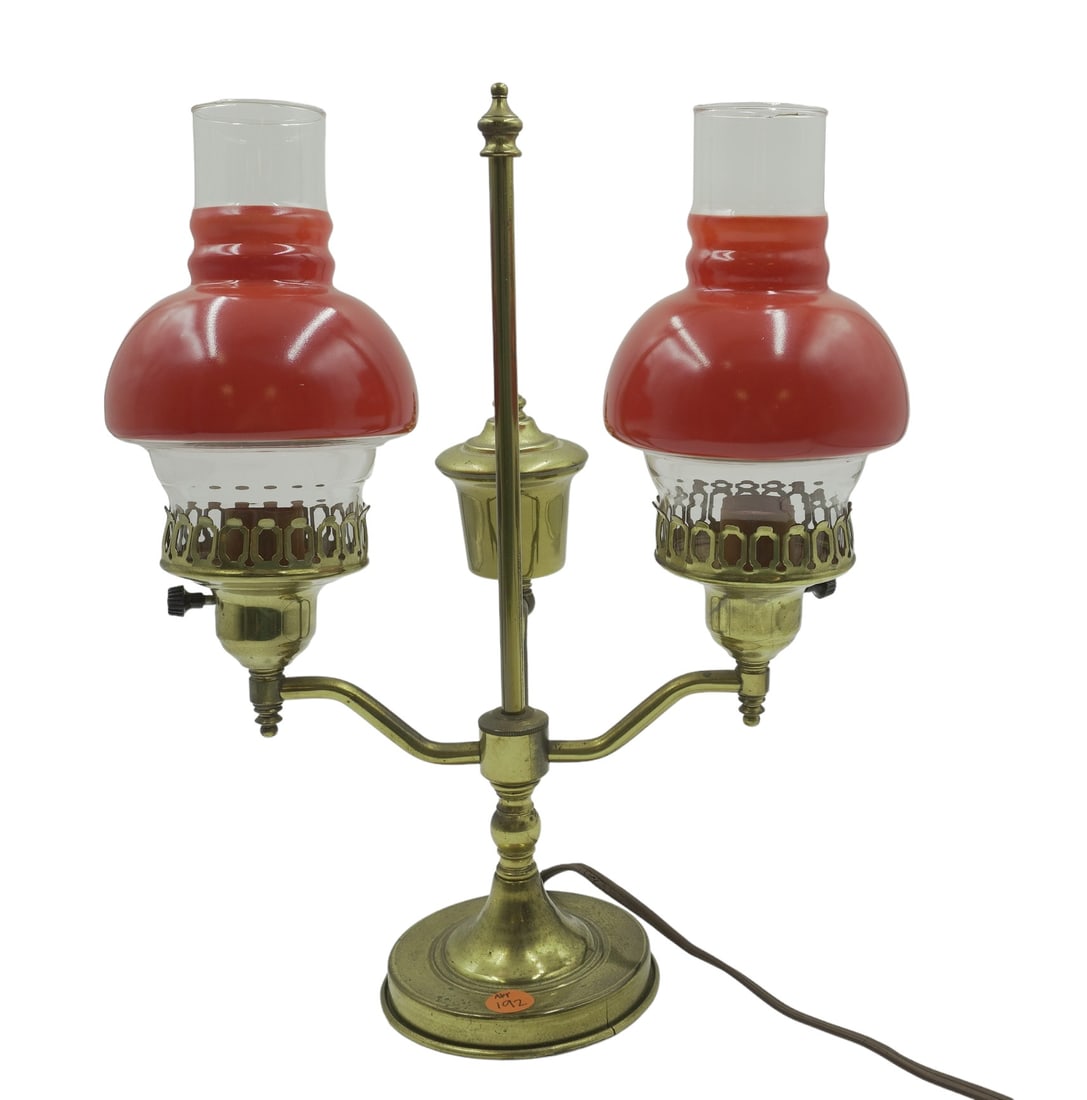 DUAL ELECTRIFIED STUDENT LAMP WITH RED GLASS: Dual Electrified Student lamp with Red and Clear Glass Lamp Shades. Comes with original wiring. Measures about 15" tall, 11.5" long, and 5.75" wide. Weighs 3 lbs 4 oz.