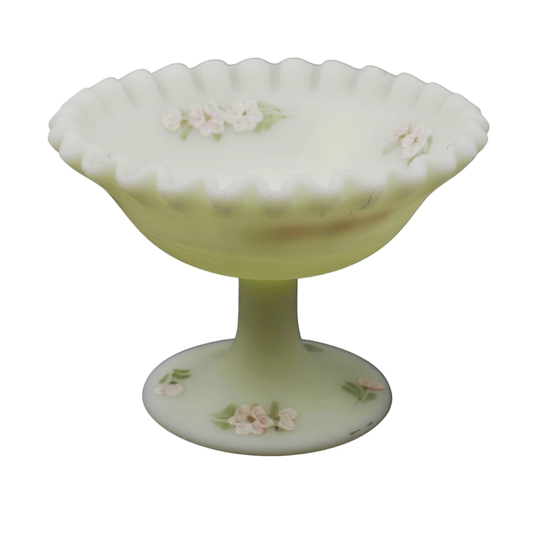 FENTON SIGNED BURMESE SATIN GLASS CANDY DISH: Vintage signed Fenton Burmese Satin Glass candy/compote dish signed Sue Foster on the bottom and stamped with fenton logo. Hand Painted details with fantastic glow under UV. Measures 3.75" tall and to