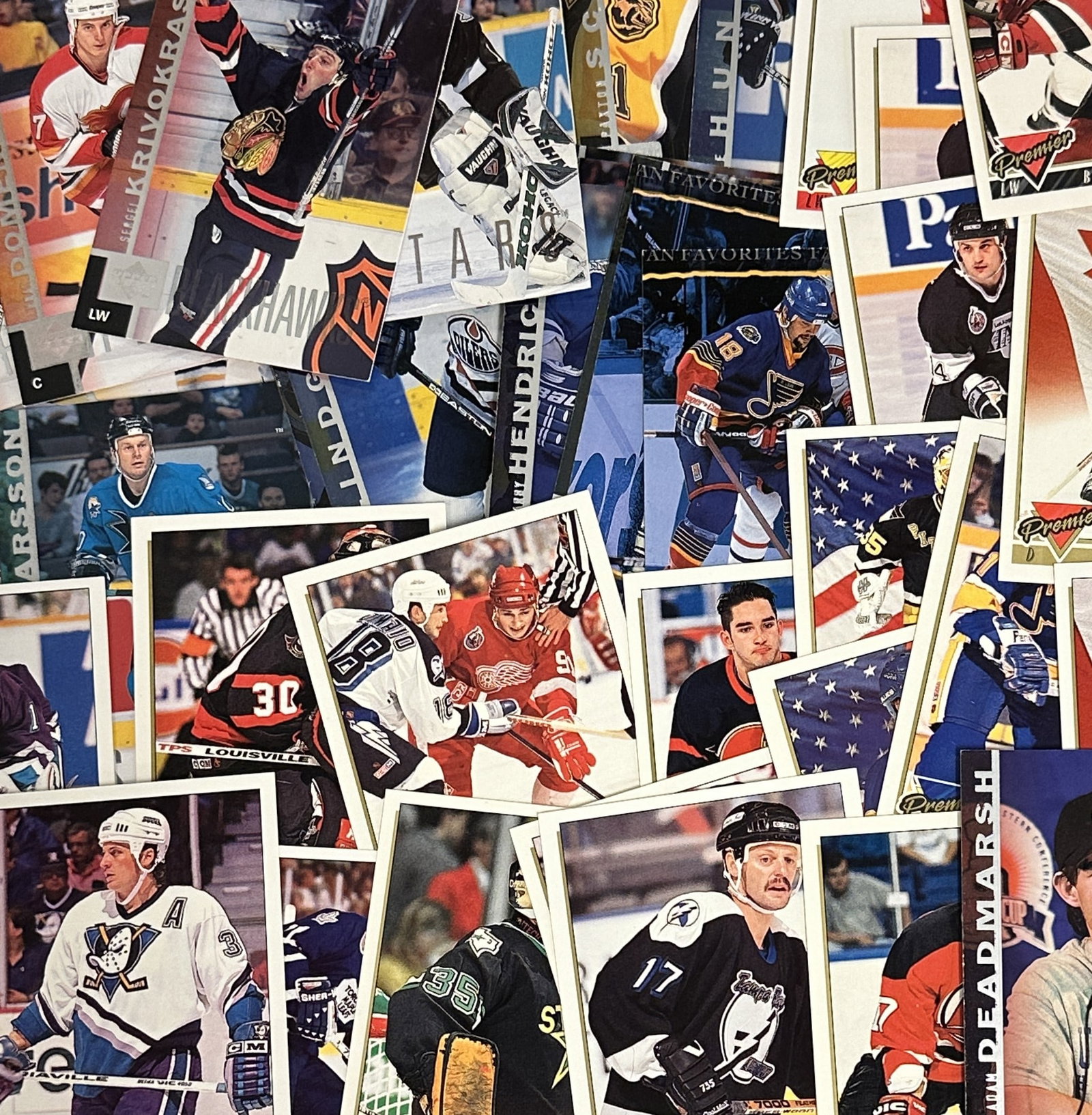 68 HOCKEY TRADING CARDS TOPPS & UPPER DECK: Hockey Trading cards. 41 are 1994 Topps Premier, 27 from Upper Deck. All are in excellent condition. Great lot for collectors or dealers 3.5"x2.5". Weight on all 5 oz.